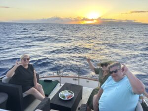 Guests enjoying the views of the Sunset aboard the Kona Star, Ocean Adventures Hawaii
