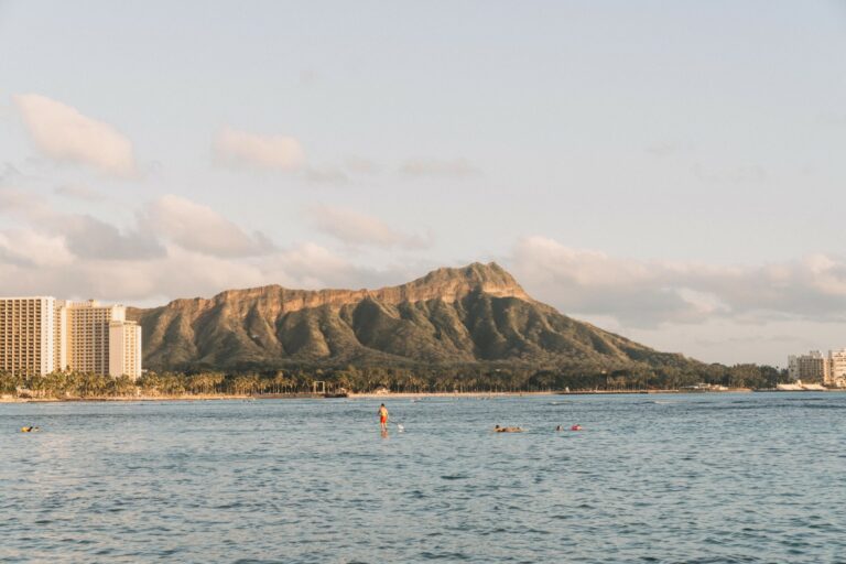 A shot of Diamond Head next to the water and the city of Honolulu.